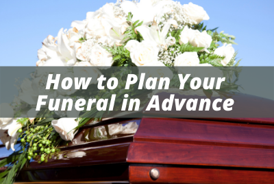 white flowers on funeral casket